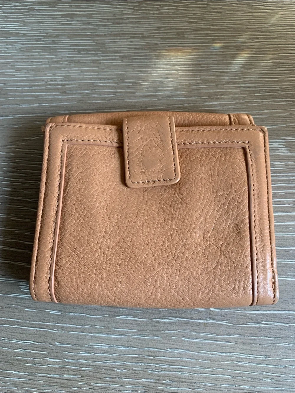 Tory Burch caramel tan leather compact wallet with logo medallion